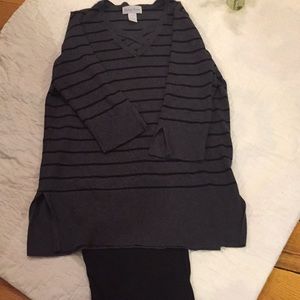 Womens gray sweater with black stripes.
